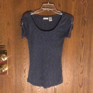 small tee with buckles on the sleeves